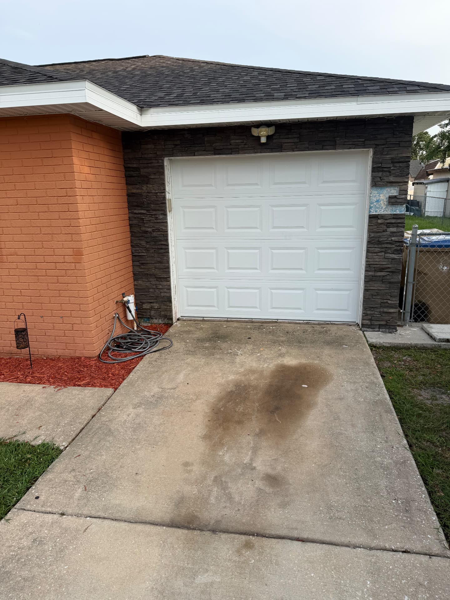 Garage driveway pressure wash before