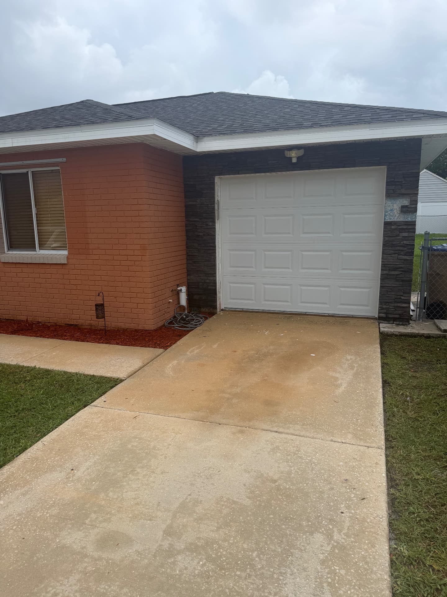 Garage driveway pressure wash after